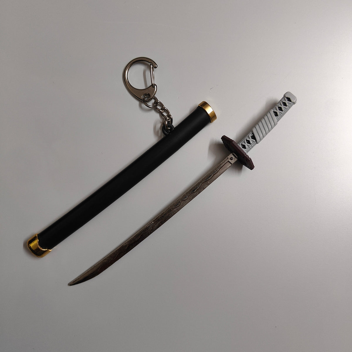Giyu Tomioka Mini Katana Sword Keychain – Water Hashira Nichirin Blade | Demon Slayer